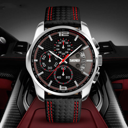 Montre quartz en cuir pour homme avec cadran rond noir, chronographe et bracelet noir à coutures rouges.