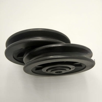 Accessoire plastique pour équipement de fitness, poulie modèle 95 noire.